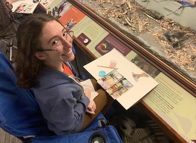 Michelle drawing at Field Museum