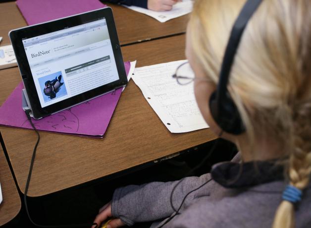 Student in classroom listening to BirdNote