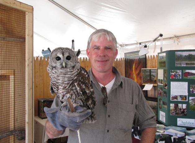 Patrick Comins holding owl