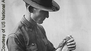 Soldier with carrier pigeon