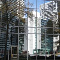 Skycrapers' glass windows reflected in another windowed building